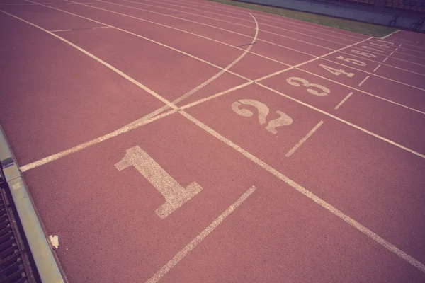 Numbers on running track  in stadium vintage color — Stock Photo, Image