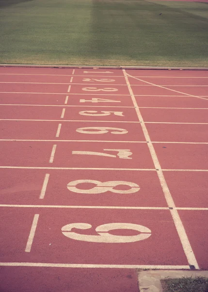 Numbers on running track  in stadium vintage color — Stock Photo, Image