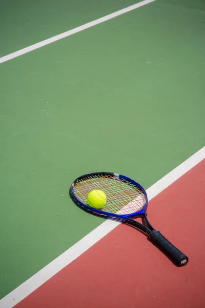 Tennis racket and balls on the tennis court Stock Photo