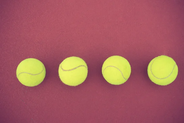 Tennis balls on the tennis court vintage color — Stock Photo, Image