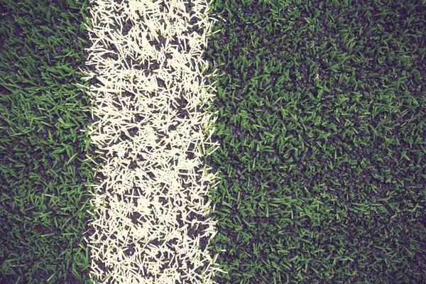 White stripe on the green soccer field from top view vintage col