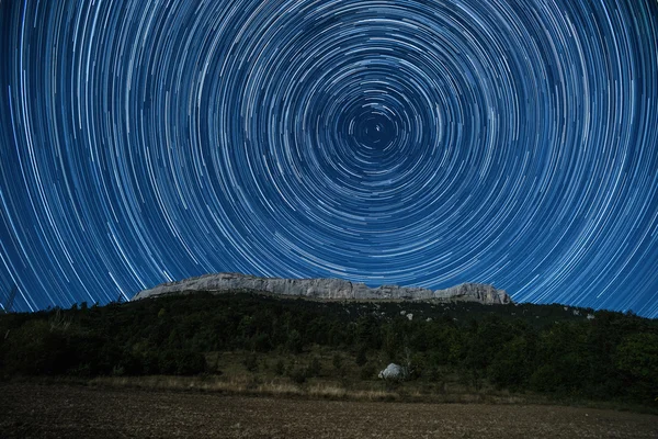 Star trail above Ceuse crag Stock Picture