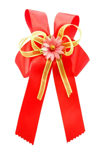 Red bow and artificial flower — Stock Photo, Image