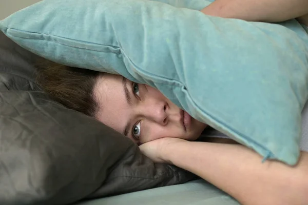 Young Woman Covers Her Ears Pillows Hear Noise Interferes Her — Stock Photo, Image