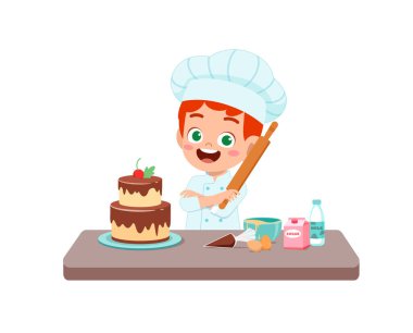 Küçük tatlı bir çocuk ve kız şef üniforması giyer ve doğum günü pastası pişirir.