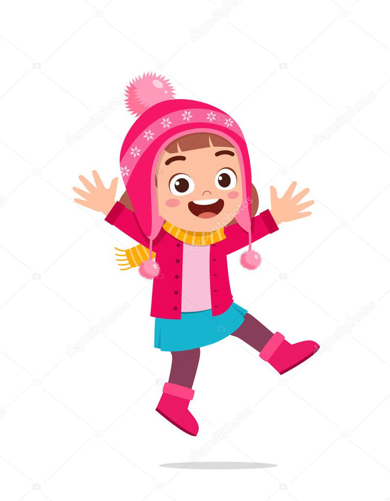 happy cute little kid play and wear jacket in winter season. child smile wearing warm clothes