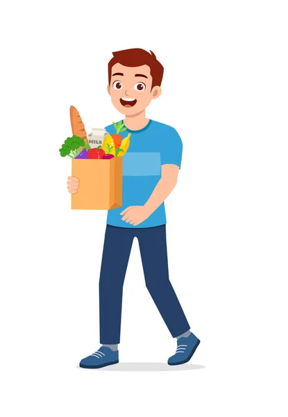 Junger Gut Aussehender Mann Trägt Tasche Voller Lebensmittel — Stockvektor