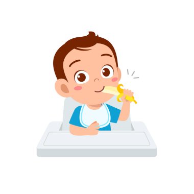 Tatlı küçük oğlan meyve ve sebze yiyor.