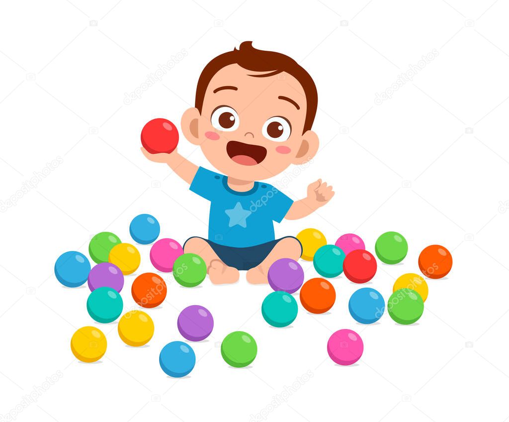 cute little baby boy playing with colorful balls