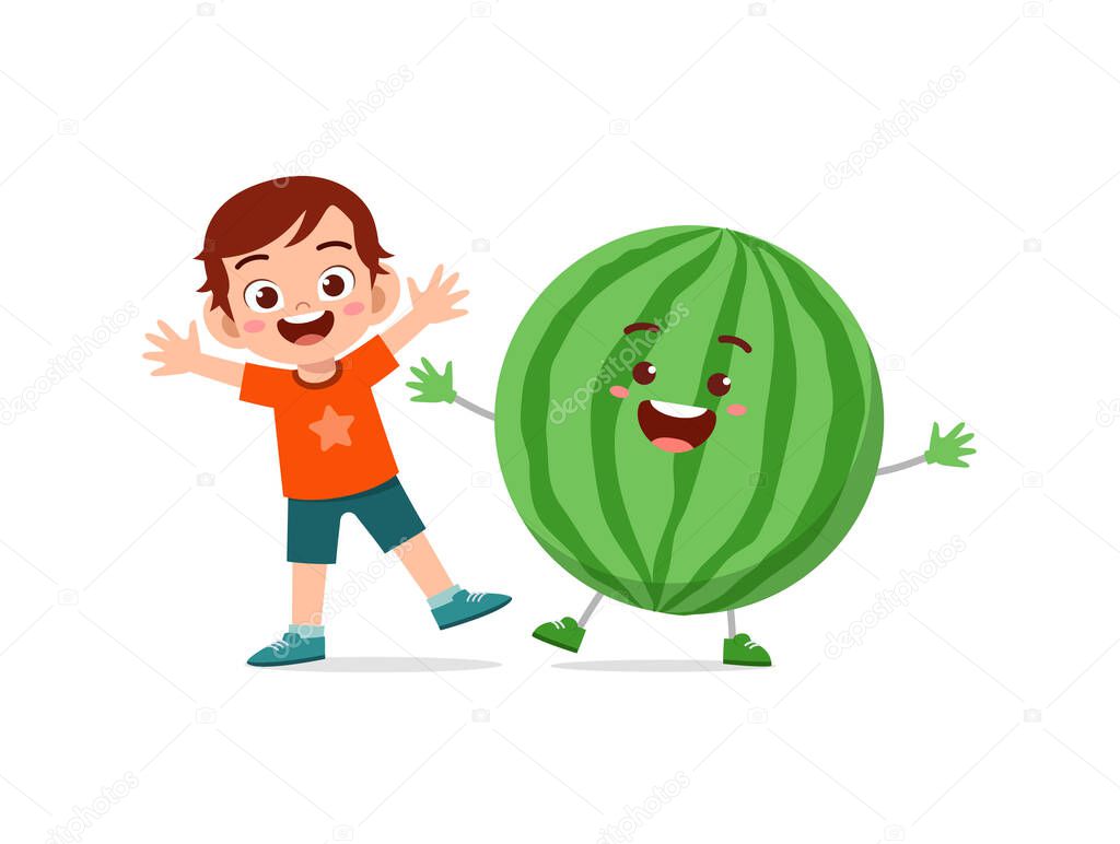 cute little boy stands with watermelon character