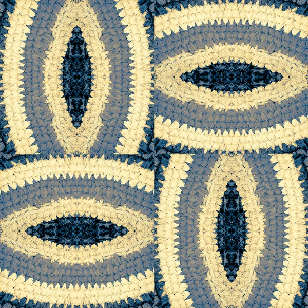 Абстрактний візерунок з в'язаних частин килимка — стокове фото