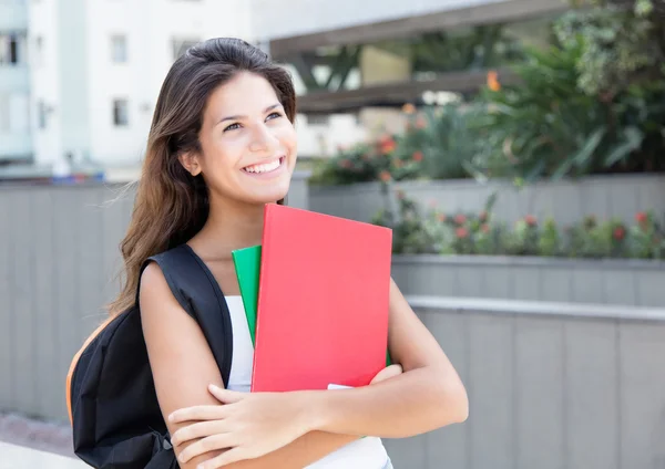 Dreaming caucasian female student in the city — Stock Photo, Image