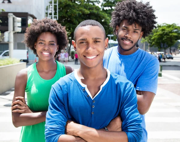 Group of african american young adults with crossed arms — Stock Photo, Image