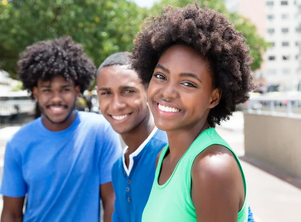 African american woman with two friends in the city — Stock Photo, Image