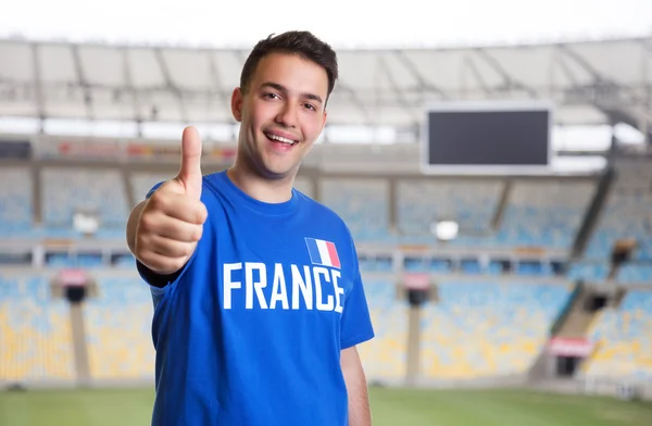 Franska sportfantast på stadion visar tummen — Stockfoto