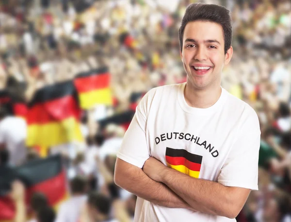 Handsome fan in german jersey  with other fans