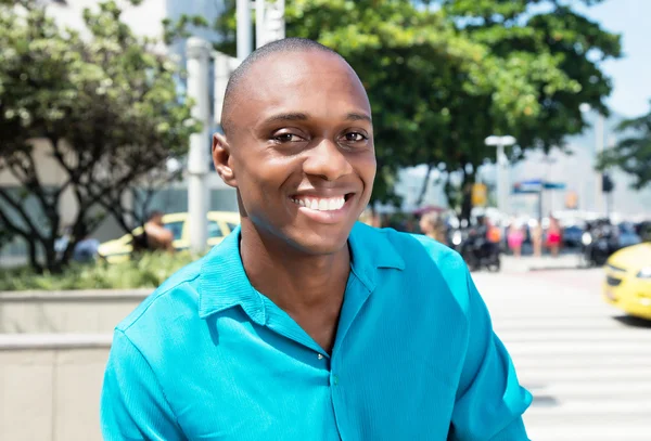 Happy african american man in bright shirt — Stock Photo, Image