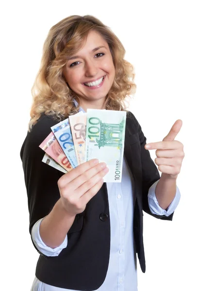 Woman with blond hair pointing to money — Stock Photo, Image