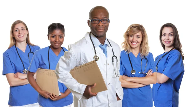 Smiling african doctor with 4 nurses — Stock Photo, Image