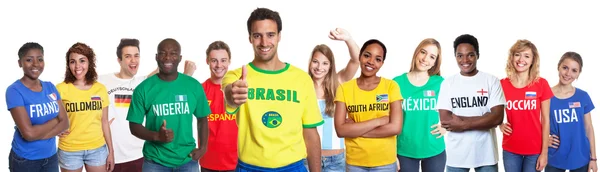 Brazilian sports fan showing thumb with 10 international fans — Stock Photo, Image