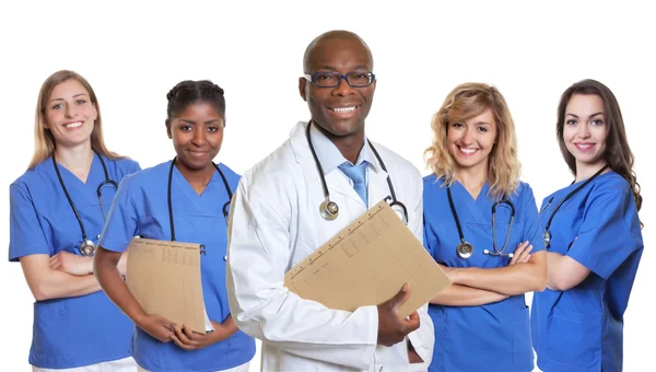 Laughing african doctor with group of international nurses — Stock Photo, Image