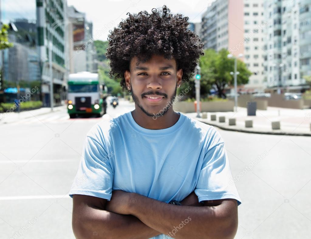 African american guy with typical hairstyle in city
