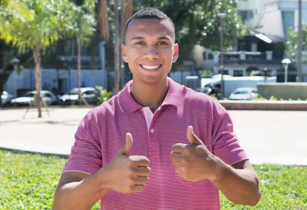 Mexican guy in the city showing both thumbs — Stock Photo, Image