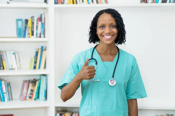 Laughing African American Mature Nurse Showing Thumb Clinic — Stock Photo, Image