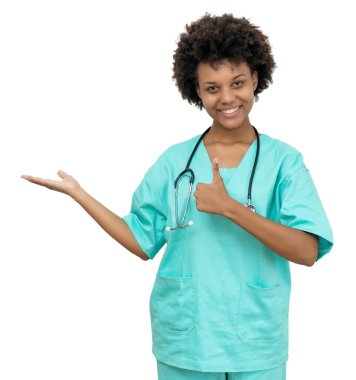 Laughing african american medical student pointing sideways isolated on white background for cut out clipart