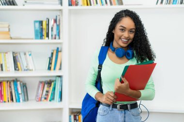 Amazing brazilian female college student with braces at classroom
