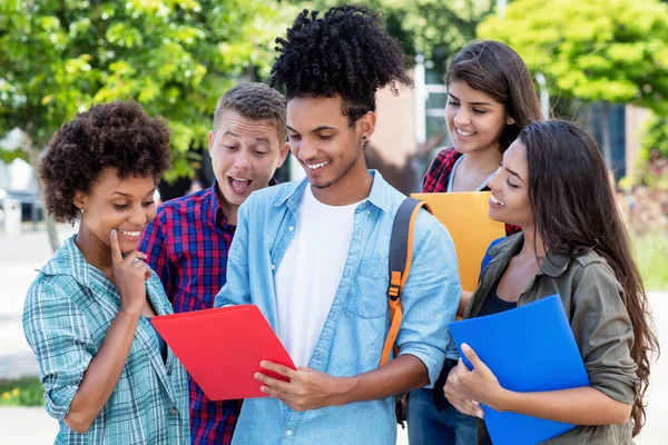 Laughing Young Hispanic Male Student Talking Multi Ethnic Young Adults — Stock Photo, Image