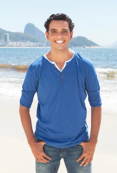 Cool latin guy at Copacabana beach at Rio de Janeiro — Stock Photo, Image