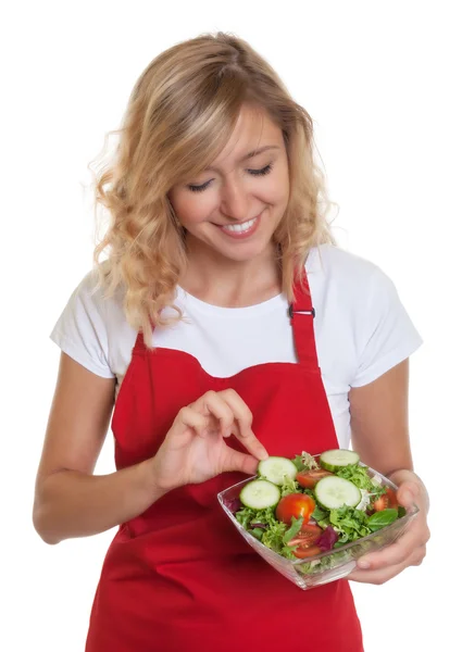 Housewife with blonde hair preparing salad — Stock Photo, Image