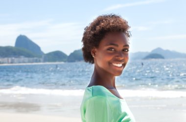 Happy brazilian woman at Copacabana beach clipart