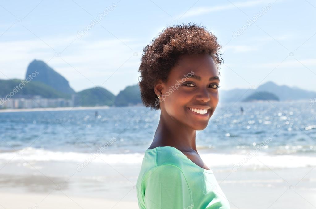 Happy brazilian woman at Copacabana beach