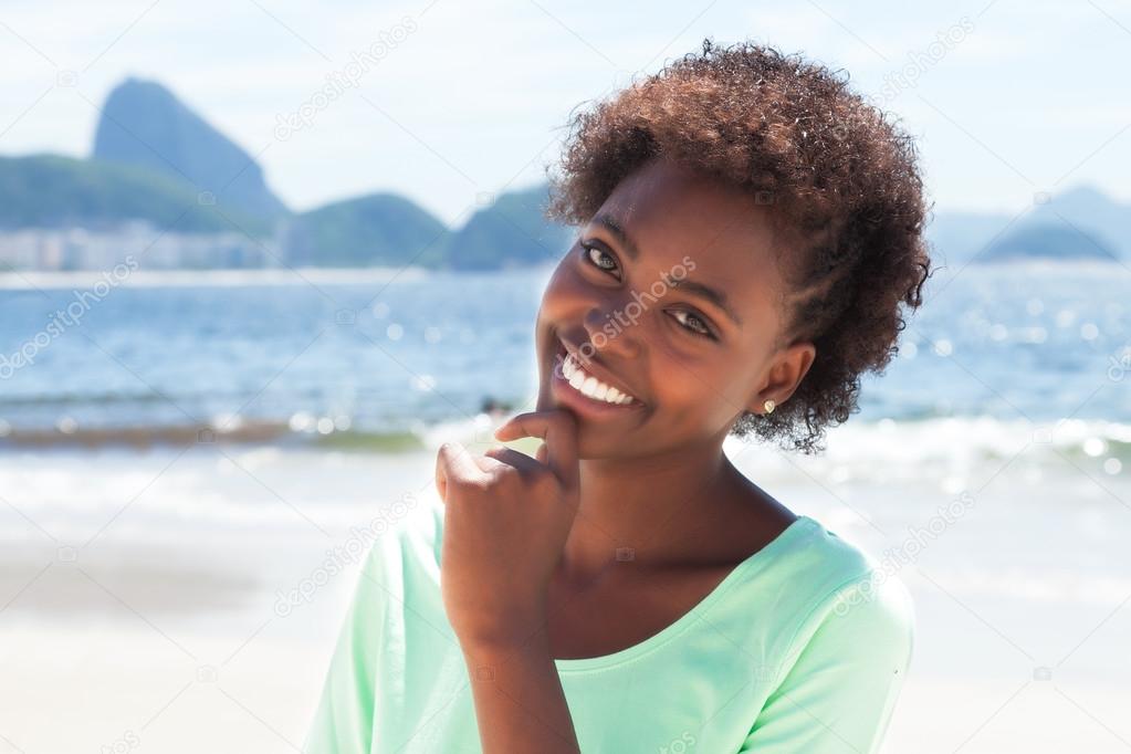 Laughing brazilian woman at Copacabana beach