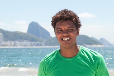 Happy man from Rio de Janeiro at Copacabana beach clipart