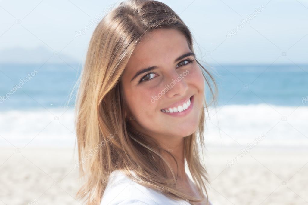 Young blonde woman at beach