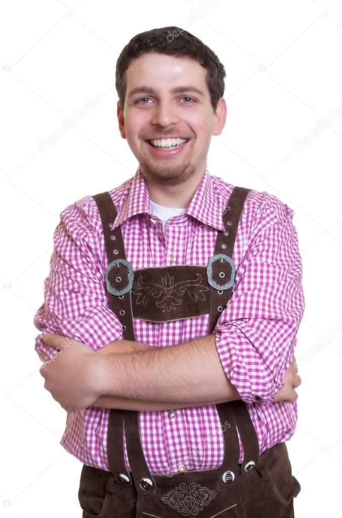 Laughing bavarian guy with leather pants and crossed arms