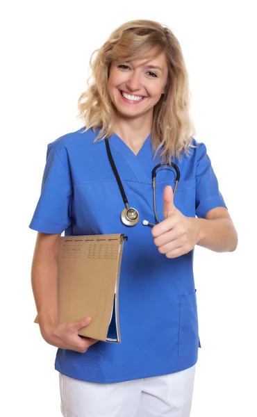 Beautiful nurse with curly blonde hair and medical file showing — Stock Photo, Image