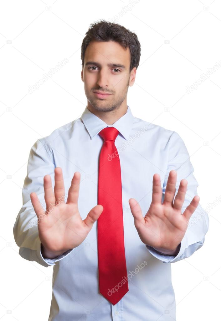 Businessman with red tie say stop