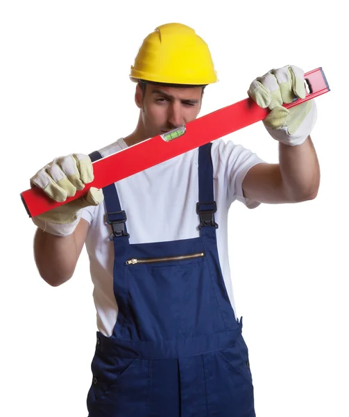 Latin construction worker with level — Stock Photo, Image