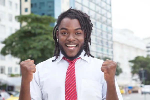 Cheering african american businessman with dreadlocks in the cit — Stock Photo, Image