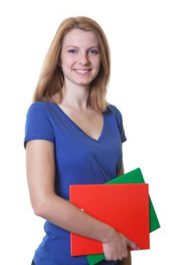 Kızıl saçlı ve kitaplar genç öğrenci gülüyor