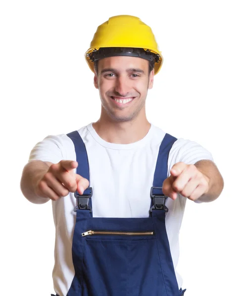 Latin construction worker pointing at camera — Stock Photo, Image