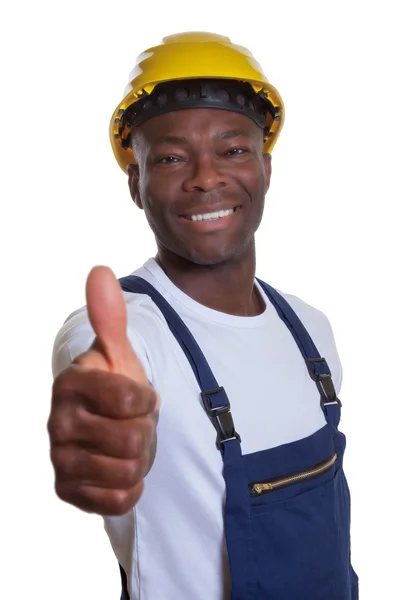 Trabajador de la construcción africano mostrando pulgar hacia arriba — Foto de Stock