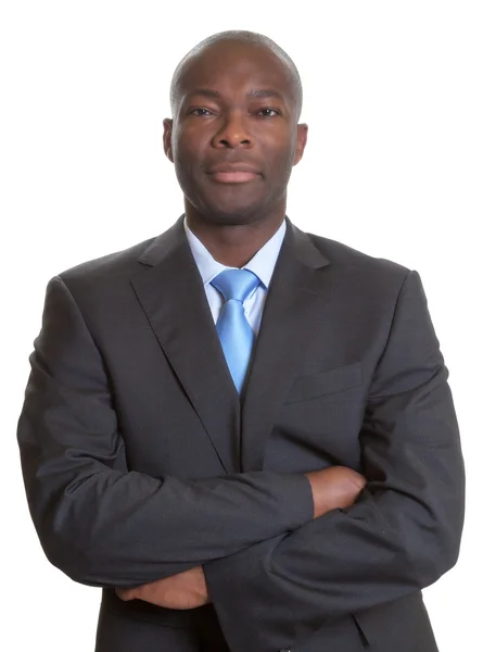 Handsome african businessman in a dark suit — Stock Photo, Image