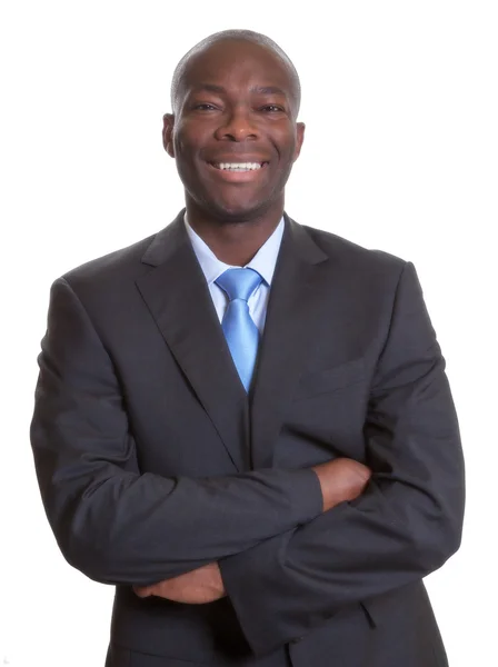 Happy african businessman in a dark suit — Stock Photo, Image