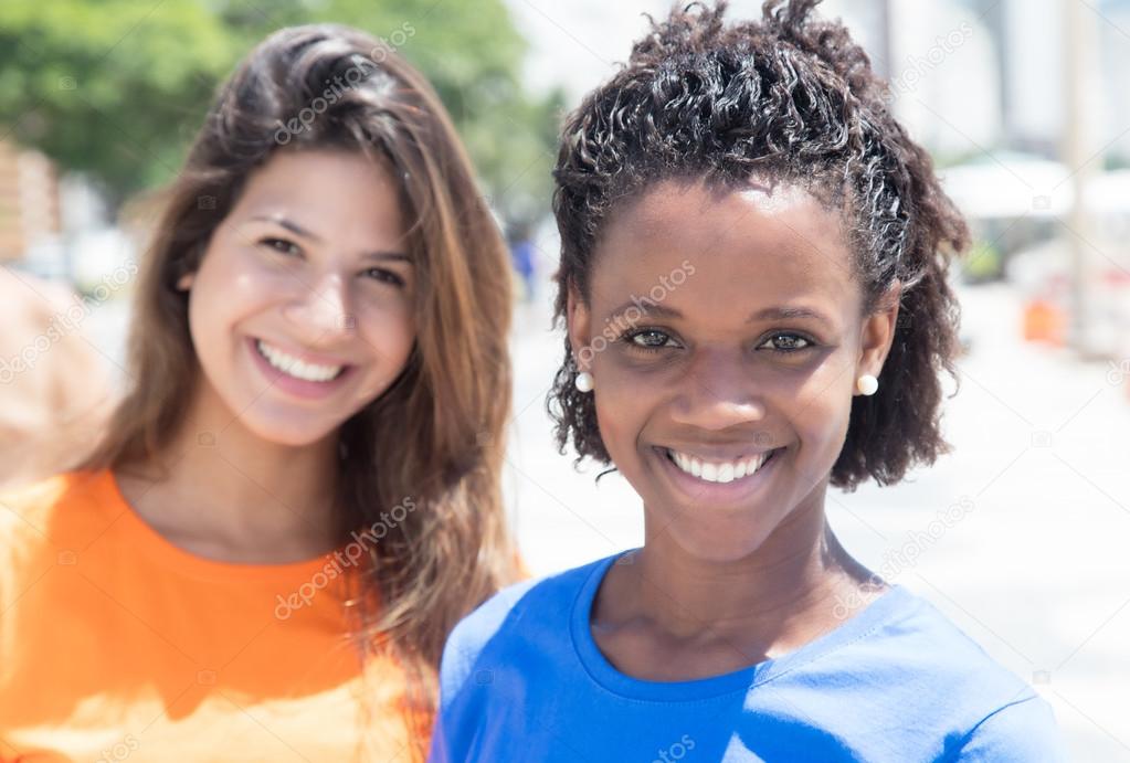 African american girl with caucasian girlfriend in the city