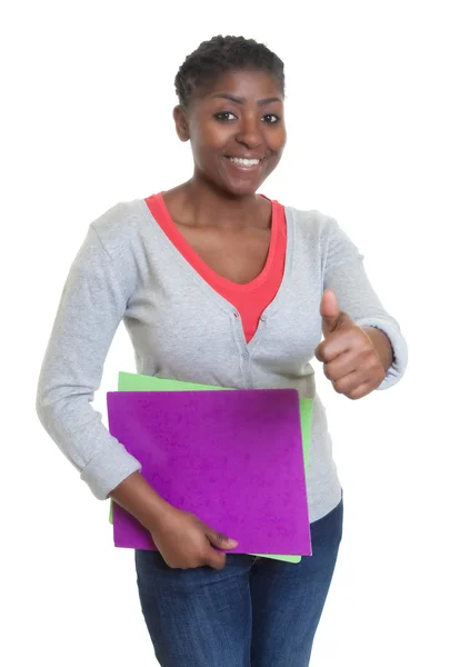 African american student med pappersarbete visar tummen — Stockfoto